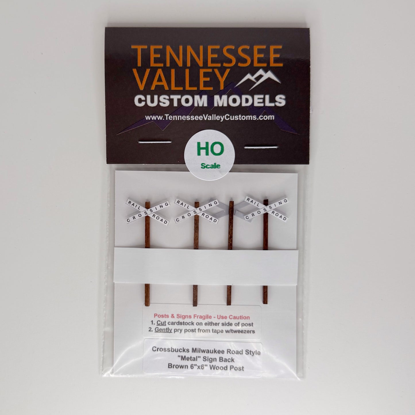 Model Railway Sign, Model Railroad Sign, Milwaukee Road Crossbucks,White background, x shape, four pack, Model Railroad Layout, Diorama, metal pole, white post, brown post, Scale, O Gauge, N Scale, N Gauge, HO Scale, HO Gauge, S Scale, S Gauge 